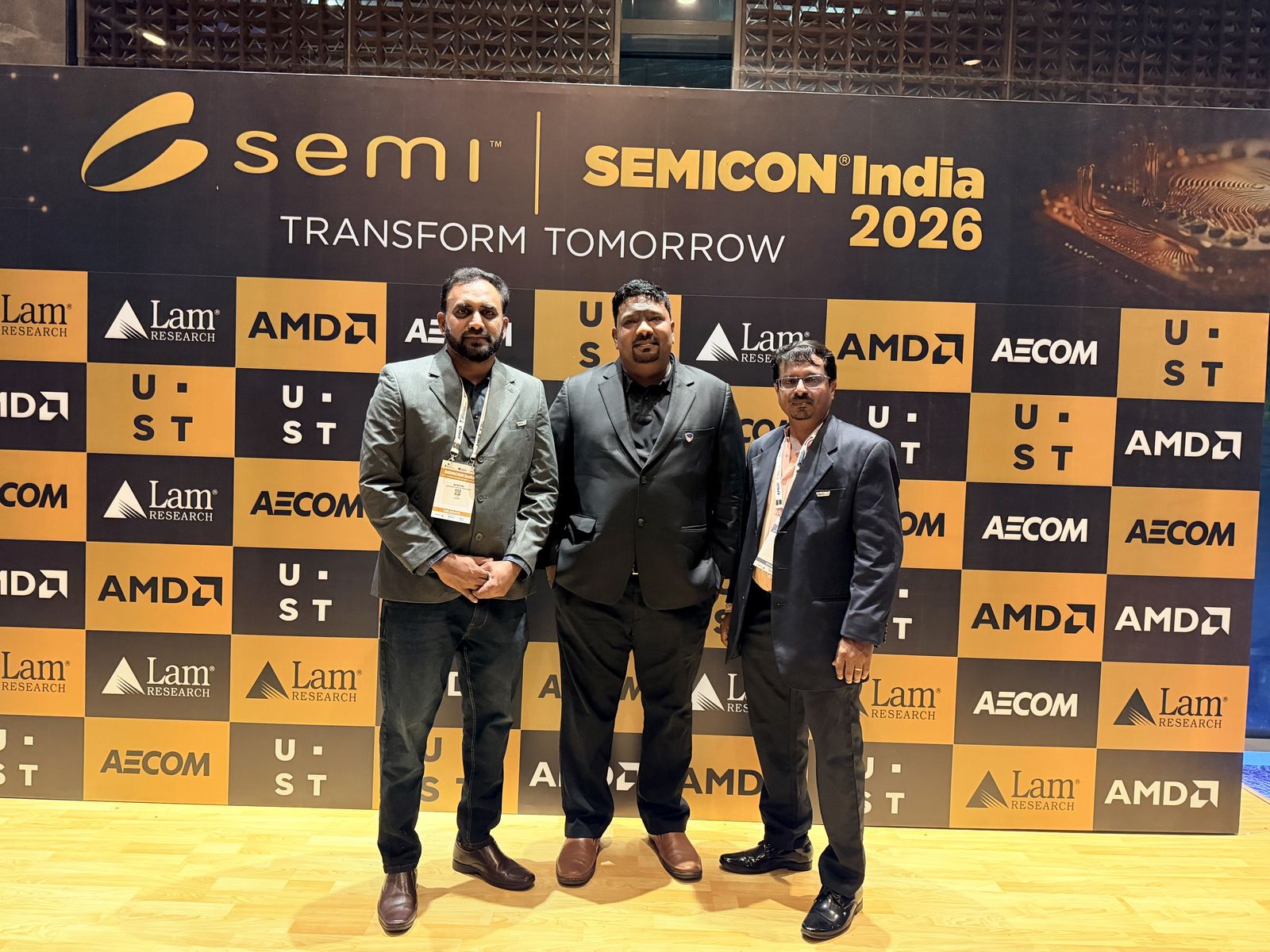 Venkatesh Kumar Pandurengan with colleagues at the SEMICON India 2026 backdrop