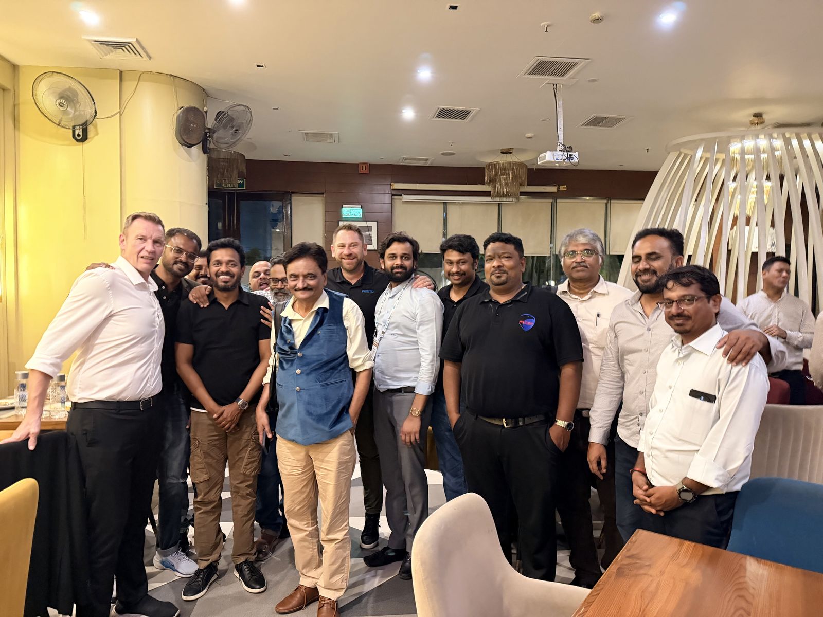 Venkatesh Kumar Pandurengan with a large group at an evening gathering during SEMICON India