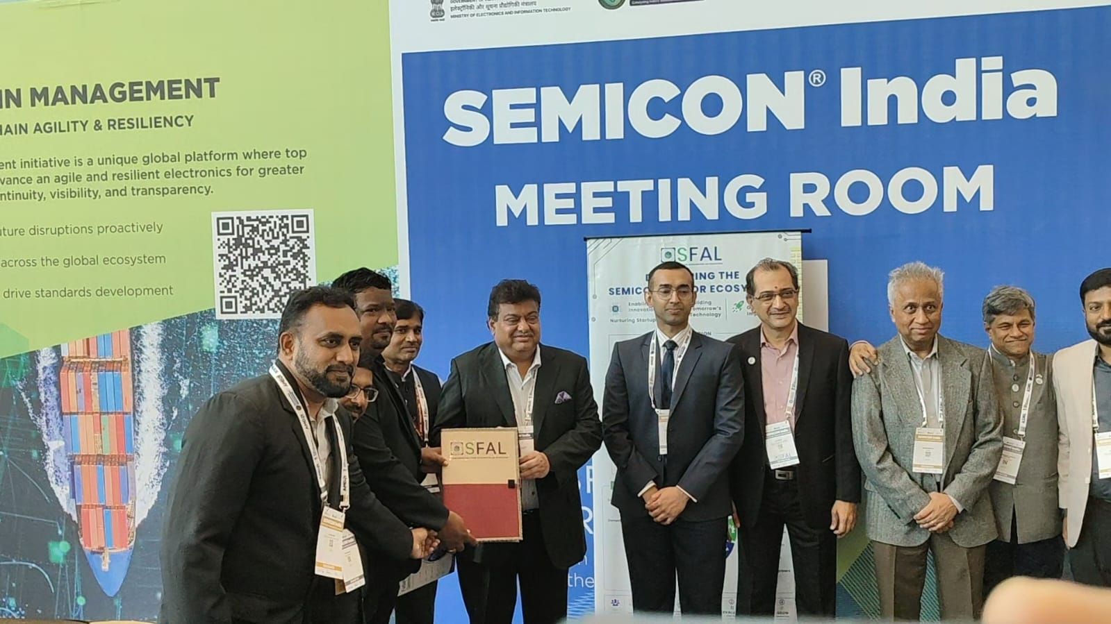 A document being exchanged in the SEMICON India meeting room